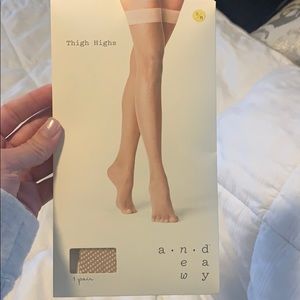 Tan fishnet thigh highs